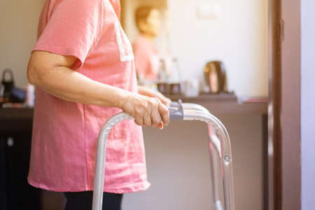 Elderly women hands holding walker trying to walking at home,Physical therapy conceptの写真素材