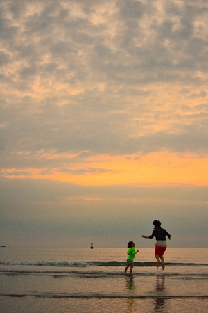 Mother and Daughter a Summer Day in Beachの写真素材