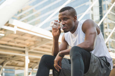 African black people drinking water after workoutの写真素材
