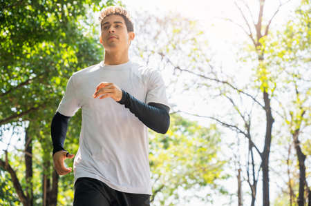 Handsome Healthy runner jogging outdoor. Fitness and sport healthy lifestyle concept.