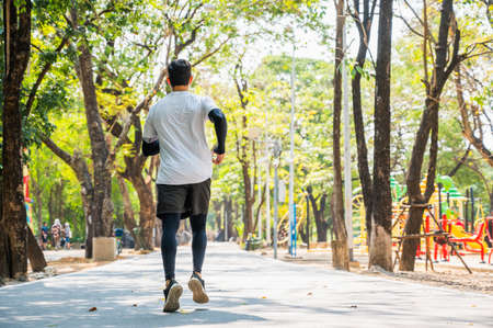 Handsome Healthy runner jogging outdoor. Fitness and sport healthy lifestyle concept.