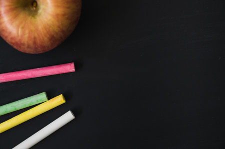 Top view blackboard chalk and apple. Education background concept.の写真素材