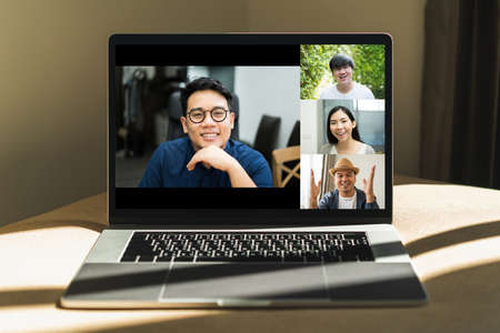 Asian business people video conference online on laptop. Meeting businessman and woman discussion...