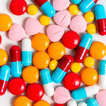 A lot of pills colorful on the white background. Medicine pills, tablets and capsules.の写真素材