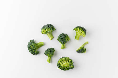Fresh Healthy vegetables and food. Raw broccoli cut into small pieces and put in white bowl background.の写真素材