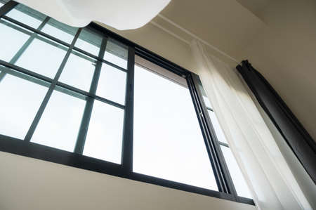 The windows and curtains of the house slide open to the cool fresh air, the wind blows without...