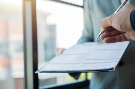 Business men give a pen to sign a contract Business people sign documents