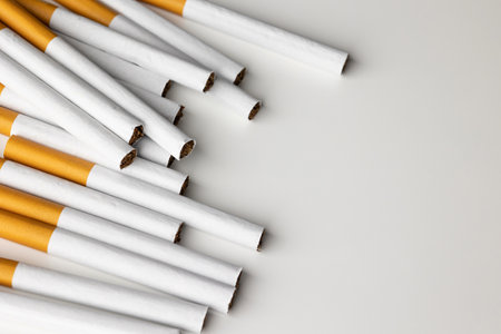 Many cigarettes stacked together. Drugs are harmful to the respiratory system.