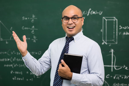 Young asian teacher man teaching video conference with student. Male Indian teacher training the mathematics in classroom from online course.の写真素材