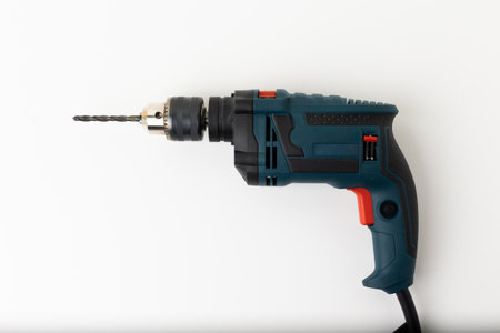 Electric drill on the isolated whited white background.の写真素材
