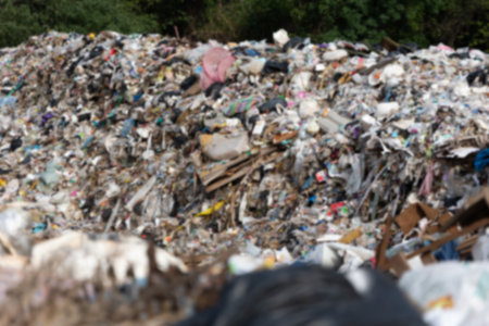 Abstract blurred image. Large Waste plastic bottle pile at Garbage pit landfill sites. A lot of Garbage for recycle management.の写真素材