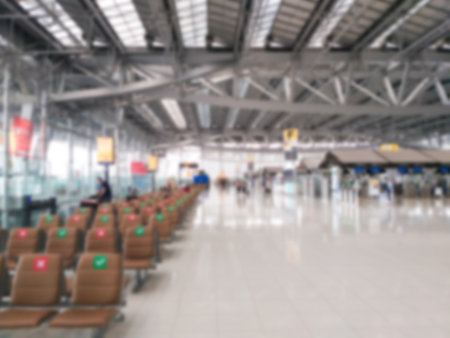 Abstract blurring image of airport terminal background. Travel passenger departure and arrival hall.の写真素材