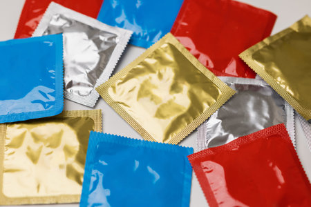 Colorful lot of condom put on the table. Campaign for safe sex and contraception.の写真素材