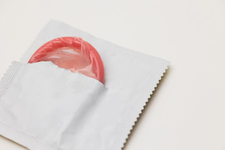 Condom package mockup put on the white table isolated.