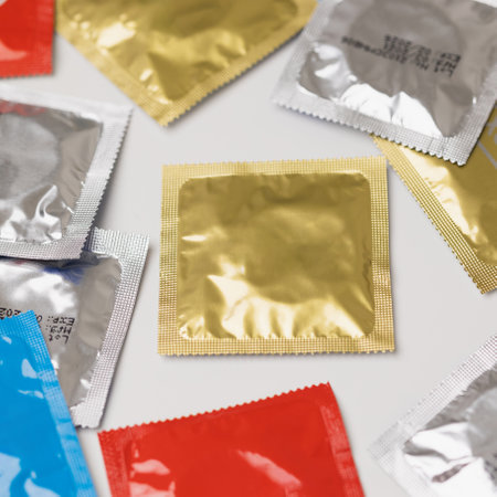 Colorful lot of condom put on the table. Campaign for safe sex and contraception.の写真素材