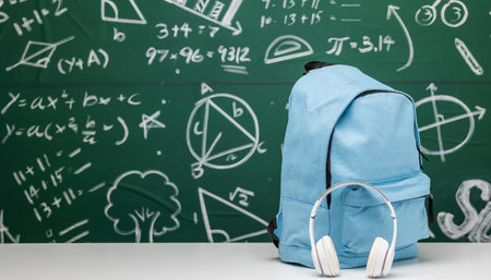 Back to school background. Stationery Supplies in the school bag. Banner design education On chalkboard with the Mathematical formula.の写真素材