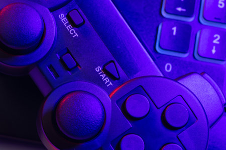 Accessory gaming keyboard joystick mouse headphone with blank space. Gadget for gamer playing video...