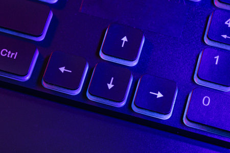 Accessory gaming keyboard with blank space background. Gadget for gamer playing video game online in...