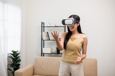 Young asian woman put on vr glasses into virtual simulated world. Future technology digital cyber...