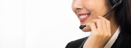 Call centre female operator. Smiling asian business woman receptionist wearing headphone video...