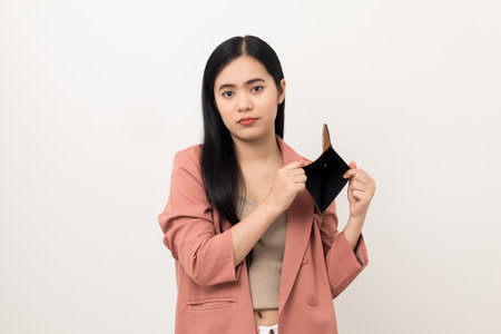Asian business woman looking at empty wallet. Flip it over but don't have money inside wallet....