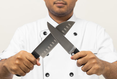 Close up male hands chef holding chef knife various gesture action on isolated white background. Cooking man Occupation chef or baker People in kitchen restaurant and hotel.の写真素材