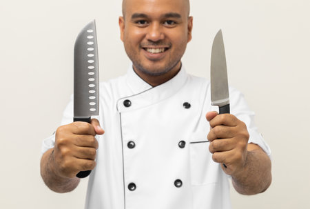 Close up male hands chef holding chef knife various gesture action on isolated white background. Cooking man Occupation chef or baker People in kitchen restaurant and hotel.の写真素材