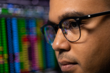 Close-up eye investor businessman analyzing a graphic of a stock cryptocurrency exchange chart and...