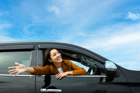 Young beautiful asian women getting new car. she very happy and excited. Smiling female driving...