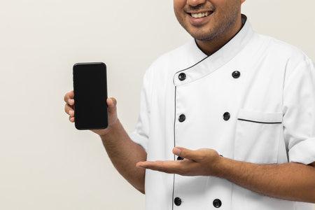 Close up male hands chef showing empty screen cellphone to choose various delicious dish menu good...