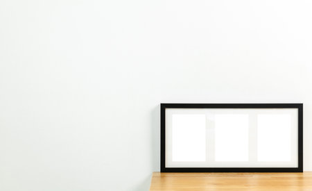 Style picture frame still life put on the wooden table. Blank space empty picture frame with mockup. Shot in studio with natural light. Template background interior design and decoration.の写真素材