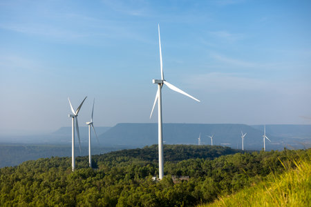 Windmill farm Generating electricity clean energy. Wind turbine farm generator by alternative green...