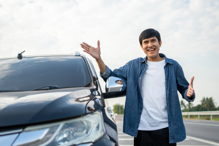 Young handsome asian man getting the new car. He hugged his car and was very happy touching detail interior . Buy or rent car concept.の写真素材