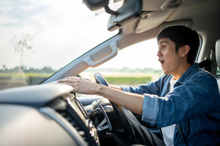 Young handsome asian man getting the new car. He hugged his car and was very happy touching detail...