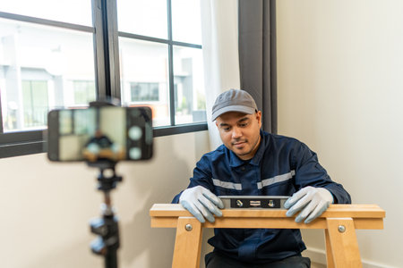Technician is record video broadcasting live teaching how to use construction tools.