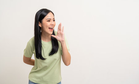 Wow Happy beautiful young asian woman excited pretty girl shout out loud wow with hands on mouth announcement standing pose looking copy space on isolated white background.の写真素材