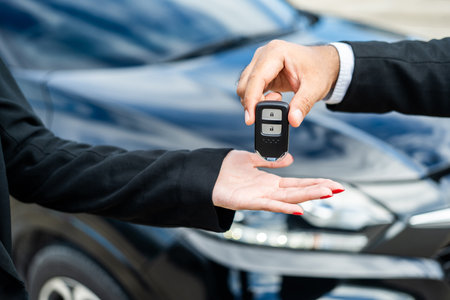 Young asian businesswoman buying new car with sale manager. she getting key and go to driving car...