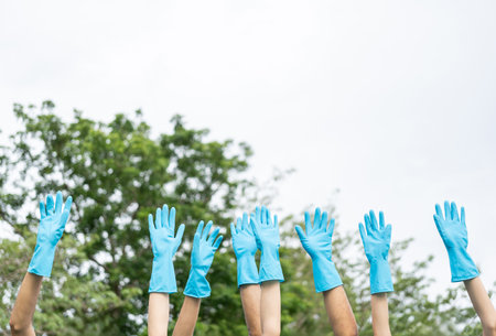Happy volunteer people group charity with garbage bags cleaning up in park. Corporate social responsibility and society activity for Environment . Ecology and CSR concept.の写真素材