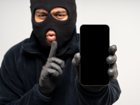 Thief in uniform black jacket various pose on isolated background. The Robber terrorism criminal...