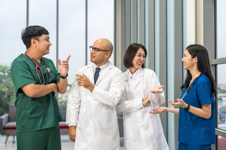 Medical team doctor planning research in a hospital and talking about patient symptoms as results x ray film. Discussion healthcare meeting group speaking about medicine strategy various actionの写真素材