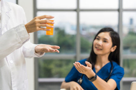 Medical team doctor planning research in a hospital and talking about patient symptoms as results x ray film. Discussion healthcare meeting group speaking about medicine strategy various actionの写真素材