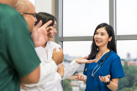 Medical team doctor planning research in a hospital and talking about patient symptoms as results x ray film. Discussion healthcare meeting group speaking about medicine strategy various actionの写真素材