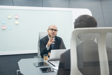 Asian business people team analyzing statistics financial. Group Team of ceo business man and woman Meeting Conference Discussion various topic. Executive professional managers Corporate in office.の写真素材