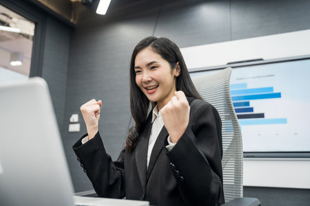 Young asian businesswoman working with laptop in the office. CEO Businesswoman analyzing statistics financial Meeting Conference Discussion various topic Corporateの写真素材