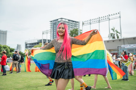 Celebrate in pride month festival. Pride movement transgender asian lesbian LGBT holding rainbow...