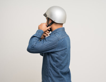 Young rider man wearing safety helmet before riding the motorcycle. Safety ride.の写真素材