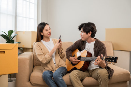 Couple asian family buying new house. Happy moment man and woman getting new home moving parcels into the house and decorate Moving relocation with lot of parcel box cardboardの写真素材