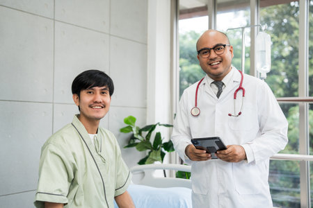 Doctors encourage patients recovery service. Doctors treat patients diseases. Life and health insurance. Advice to young man consulting about treatmentの写真素材