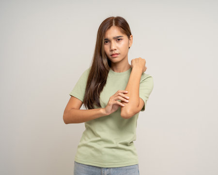 Asian woman has skin problems. She felt irritation on her skin. Skin infection itching red rash...