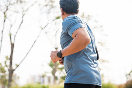 Senior old man runner exercise outdoor nature park. fitness man jogging wearing sportswear. Mature...